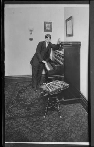 Man tuning a piano