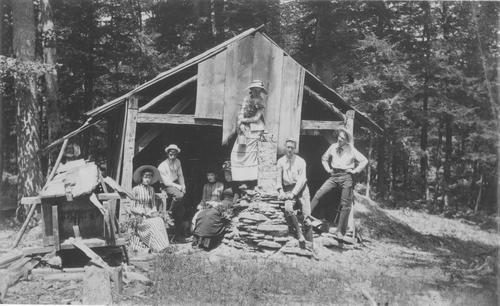 Group Photo by a Ramshackle Building