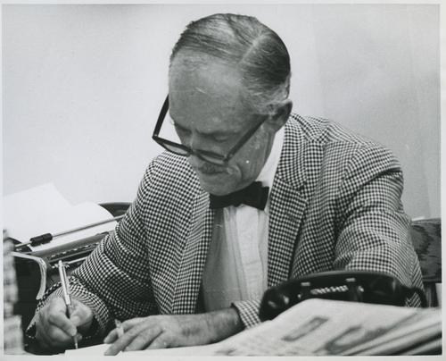 Harold V. Cohen Working at His Desk