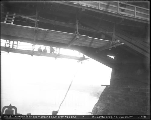 Workers underneath 16th St. Bridge (Mechanics Street Bridge)