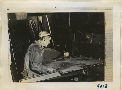 Schnabel Inserting Metal into Machine