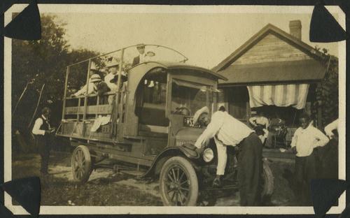 Family and friends gathered around lumber truck (2)