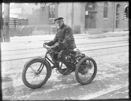 George Banker on Motor Tricycle