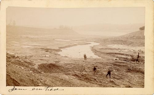 Men inside the lakebed at former Lake Conemaugh