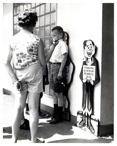 Howdy Doody and Henry measuring figurines