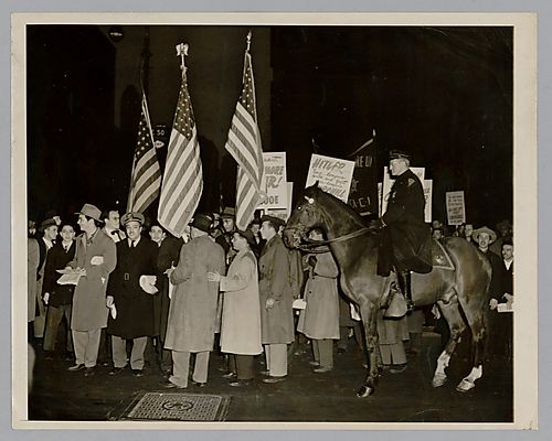 Photograph of a Protest Against Winston Churchill in front of the Waldorf-Astoria Hotel N.Y.C and Additional Information