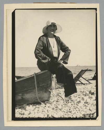 Mary Roberts Rinehart on cobble shore