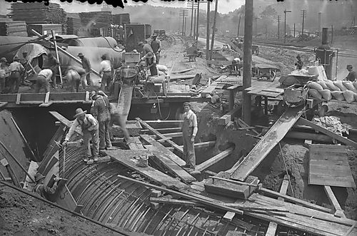 Men Placing Concrete