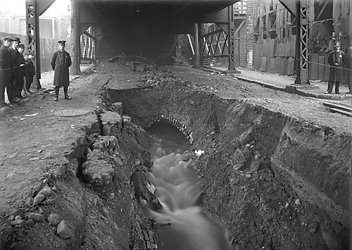 Policemen Help With 33rd Street Sewer Explosion