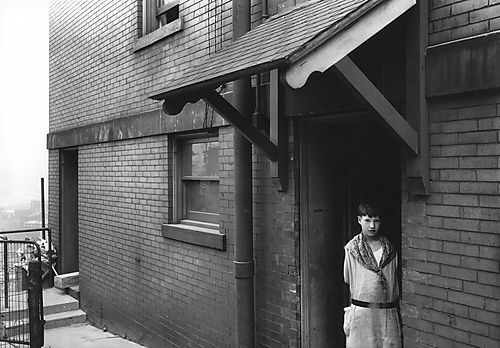 Girl in Apartment Doorway