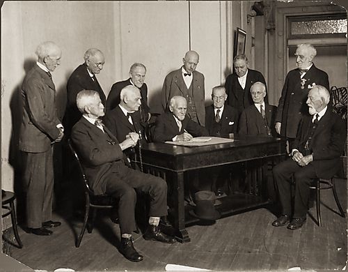 (Group Portrait: Men Witnessing a Document being Signed)