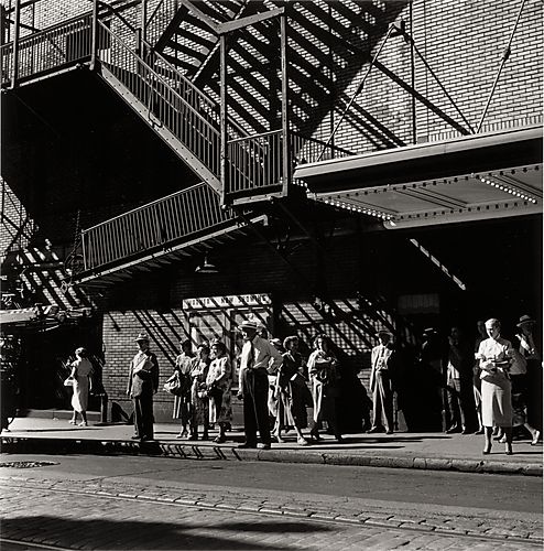 (Downtown Street Scene: People on Sidewalk in Front of Warner Theater)