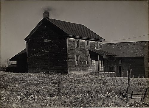 (A House with a Metal Fence)