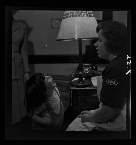 Nurse Examining Child