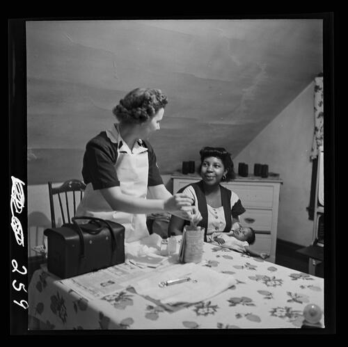 Nurse Visiting a Woman and Baby