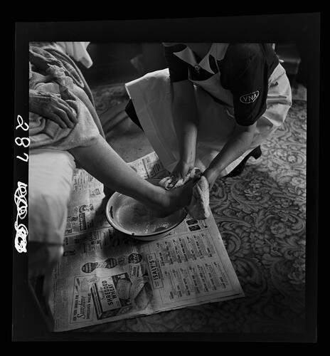 Nurse Washing Patient's Feet