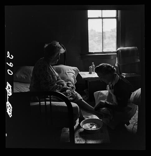 Nurse Washing Patient's Feet