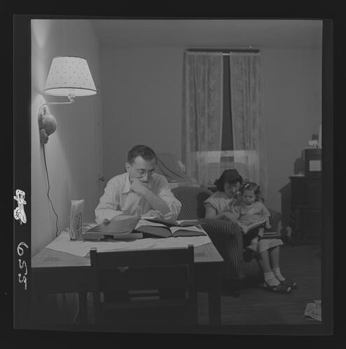 Man Reading at Table