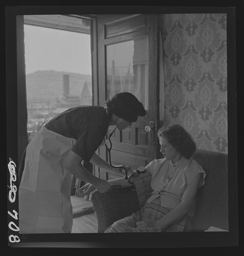 Nurse Taking Patient's Blood Pressure