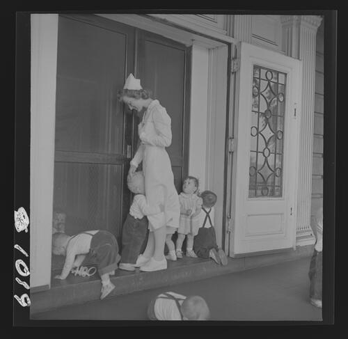 Nurse and Children on Porch