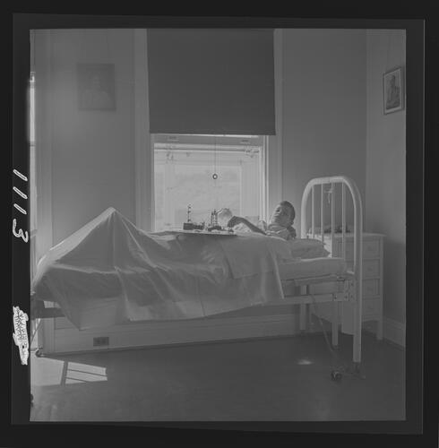 Child in Bed with Toys