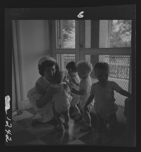 Nurse Giving Baby a Hug