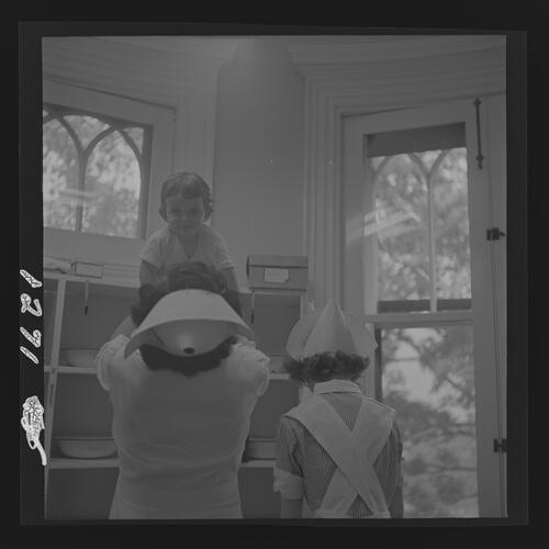 Nurse Lifting Child in the Air