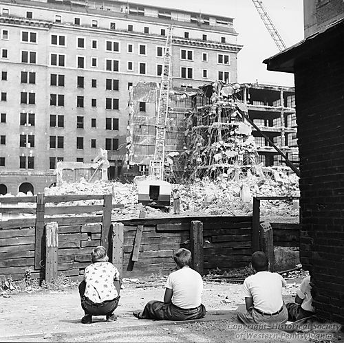 Children watching demolition work for Gateway Center