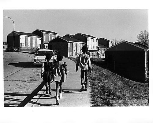 Children walking to a Housing Project