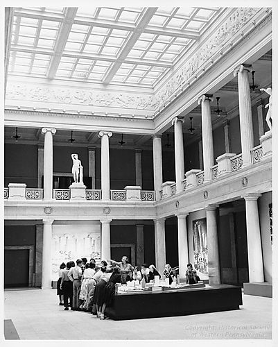Group of students view an exhibit at the Carnegie Museum of Art