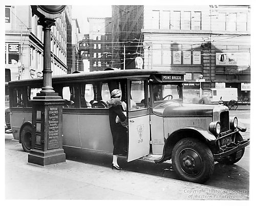 Motor Coach on a downtown Pittsburgh Street
