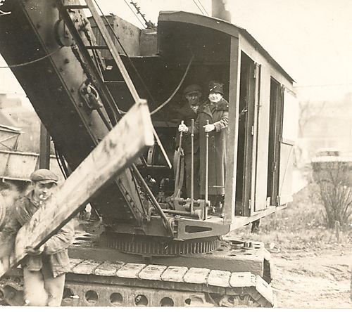 Annie Jacobs Davis on a steam shovel at groundbreaking for Montefiore Hospital