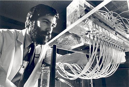 Researcher using the Mash II cell harvester 