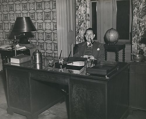 President Paul Russell Anderson at his desk