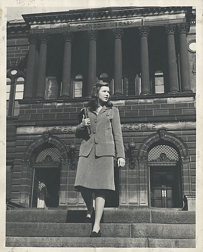 Student outside the Carnegie Library in Oakland