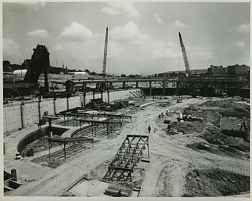 Cranes constructing wall of Civic Arena