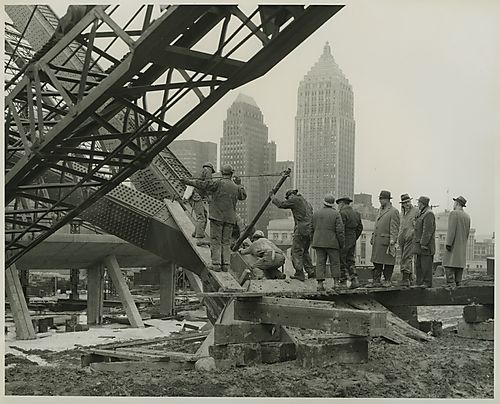 Group of men at base of Civic Arena's dome